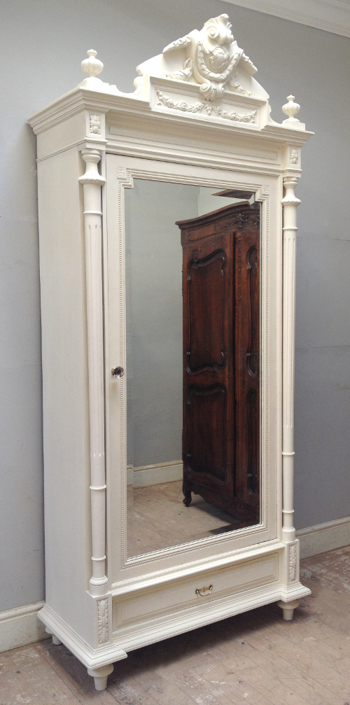 french antique crested single door armoire